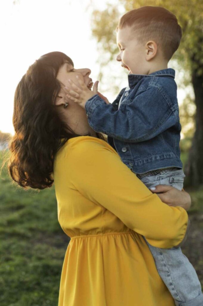 jpeg-optimizer_jpeg-optimizer_side-view-smiley-mother-holding-kid-min Best IVF Center In Ahmedabad